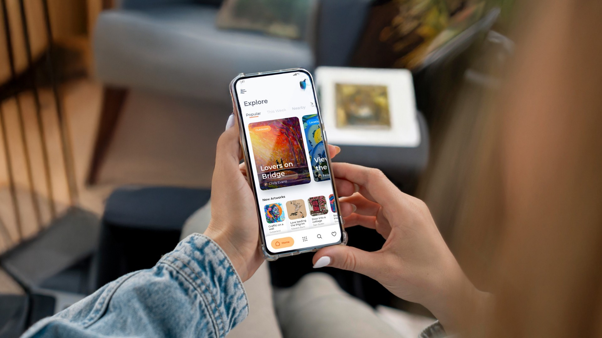 a person in art museum holding a phone and browsing an art app